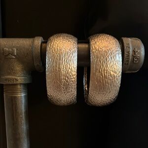 One pair of silver distressed leather bangle bracelets